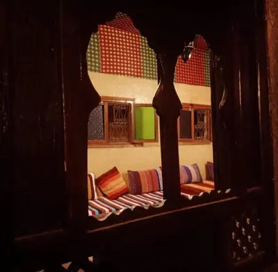 a reflection of a living room with a couch at Dar Yanis in Fès