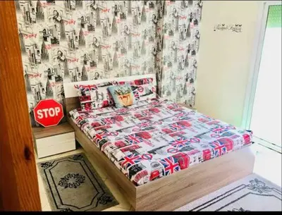 a bedroom with a bed and a stop sign at Dar Yanis in Fès