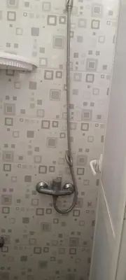a bathroom with a hanger hanging from the wall at Modern Furnished Apartment in Imouzzer Kandar