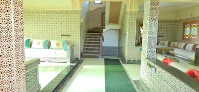a room with a staircase in a building at Atlas stay in Fès