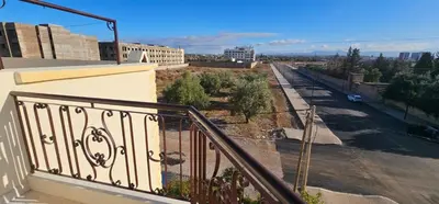 a balcony of a building with a view of a street at Atlas stay in Fès