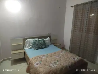 a small bedroom with a bed and a window at Studio riad zitouna in Meknès