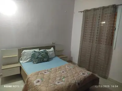a small bedroom with a bed and a window at Studio riad zitouna in Meknès