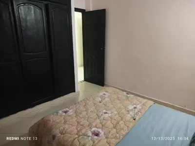 a room with a bed with flowers on the floor at Studio riad zitouna in Meknès