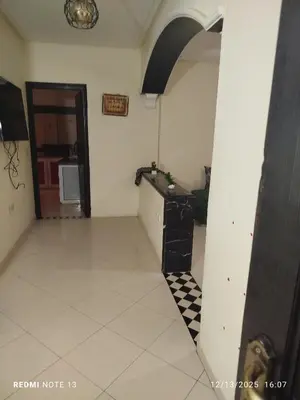 a room with a counter and a tile floor at Studio riad zitouna in Meknès
