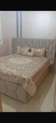 a large bed in a bedroom with a mattressvisor at Spacious apartment in Fès