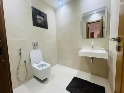 a bathroom with a toilet and a sink at Colina Smir par Immo Marina Vacances de Rêve D1-3 in Oulad Akkou