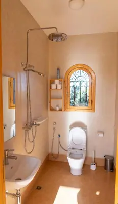 a bathroom with a toilet and a sink and a tub at Najma Ourika in Ourika