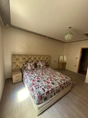 a bedroom with a large bed in a room at Hote othmane in Beni Mellal