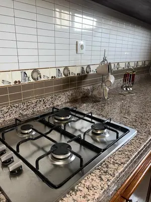 a stove top oven sitting on a counter in a kitchen at Campagne & Confort only family in El Hajeb