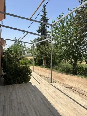 an open porch of a house with at Campagne & Confort only family in El Hajeb