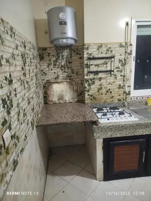 a kitchen with a sink and a stove in it at Black iris tadamoune in Meknès