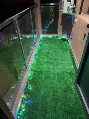 an indoor lawn with christmas lights on it at Gueliz Twin Balcony Apartment F3 in Oulad Akkou