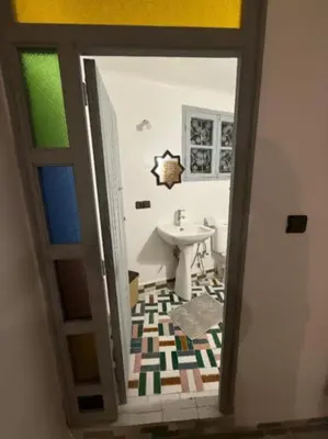 a view of a bathroom with a sink and a toilet at Fes flower in Fès