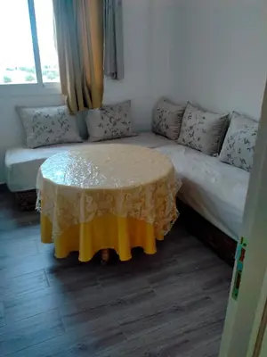 a living room with a couch and a table at Apartment with Elevator Stadium and CHU within walking distance in Fès