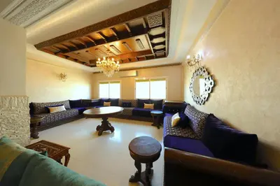 a large living room with couches and a table at Apparemment de vacances centre de fes in Fès
