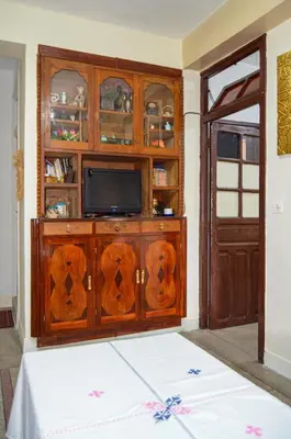 a room with a entertainment center with a television at dar sara medina fes in Fès