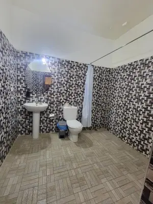 a bathroom with a toilet and a sink at Dar KAYED in Fès
