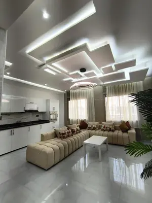 a large living room with couches and a table at Appartment in hearth of new Fes in Fès