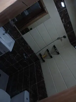 an overhead view of a shower in a bathroom at Appartement propre in Fès