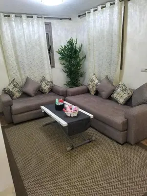 a living room with a couch and a coffee table at High-Standing Accommodations - Dalia , Tiflet in Tiflet