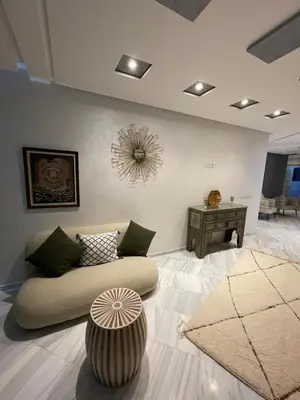 a living room with a couch and a table at Luxury Modern Apartment City Center in Meknès