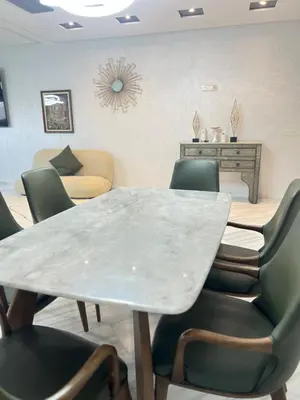 a dining room with a table and chairs at Luxury Modern Apartment City Center in Meknès