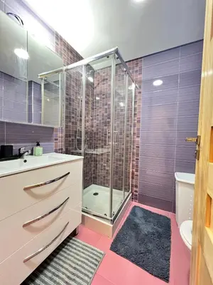 a bathroom with a shower and a sink and a toilet at Luxury Modern Apartment City Center in Meknès