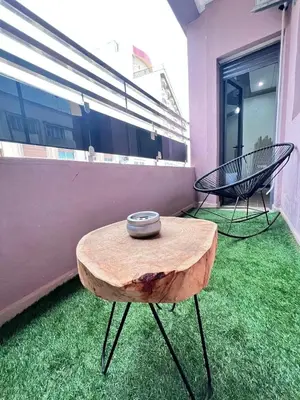 a table with a bowl on top of it in a room at large & comfotable apartment close to everything in Meknès