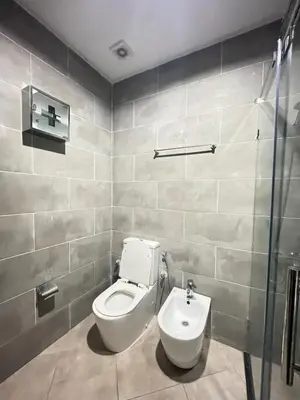 a bathroom with a toilet and a sink at large & comfotable apartment close to everything in Meknès