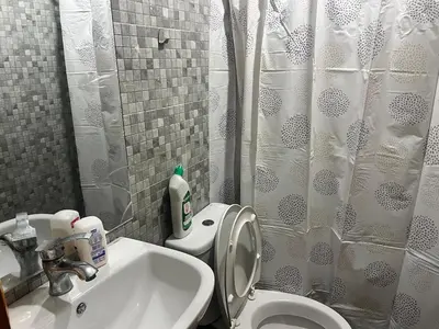 a bathroom with a sink and a toilet and a shower at Luxury University Apartment 3 in Fès
