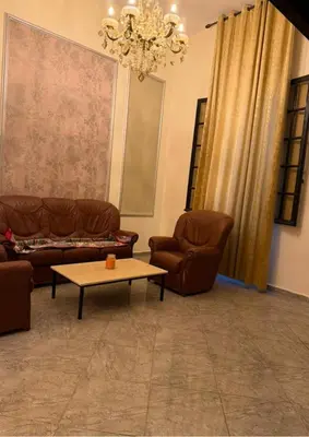 a living room with two couches and a coffee table at Atlas city fes in Fès