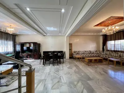 a large living room with a couch and a table at Villa Fez Prestige with jacuzzi, Chic & peaceful in Fès
