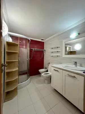 a bathroom with a toilet and a shower and a sink at Villa Fez Prestige with jacuzzi, Chic & peaceful in Fès