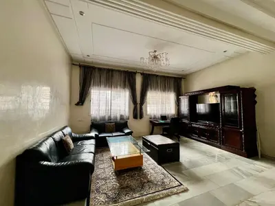 a living room with a couch and a table at Villa Fez Prestige with jacuzzi, Chic & peaceful in Fès