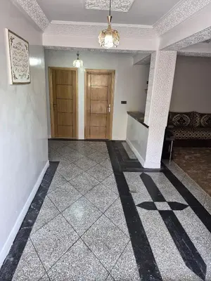 a room with a hallway with a staircase and a door at Villa avec Piscine Meknes in Meknès