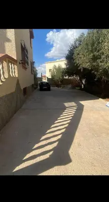 a shadow of a car parked on a street at Villa avec Piscine Meknes in Meknès