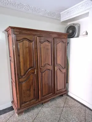 a wooden cabinet in the corner of a room at Villa avec Piscine Meknes in Meknès