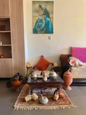 a living room with a table with bowls and other items at VIP Luxury Stay Béni Mellal in Beni Mellal