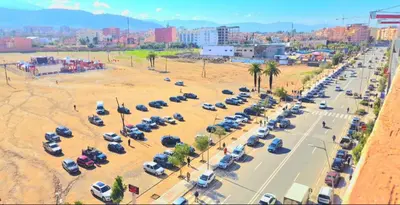 an aerial view of a parking lot with many cars at VIP Luxury Stay Béni Mellal in Beni Mellal