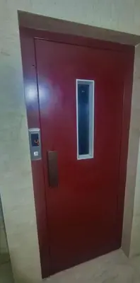 a red door with a window in a room at VIP Luxury Stay Béni Mellal in Beni Mellal