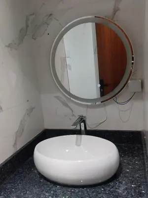 a bathroom with a sink and a mirror on a counter at Beautiful Apartment for Rent in Corniche de Rabat in Oulad Akkou