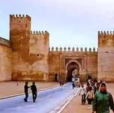 a group of people walking in front of a castle at Riad Dalal in Fès