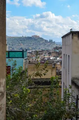 a view of a city from a building at Dar sarah médina Fés in Fès