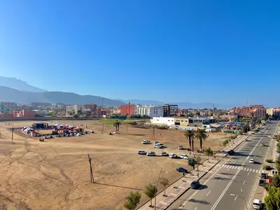 a view of a city with a parking lot at app luxe in Beni Mellal