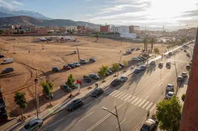 a street with cars parked in a parking lot at app luxe in Beni Mellal