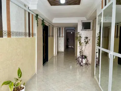 an empty hallway with plants in a building at Chic apartment in Fes luxurious and family friendly in Oulad Akkou