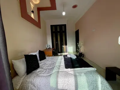 a bedroom with a large bed with pillows on it at Chic apartment in Fes luxurious and family friendly in Oulad Akkou