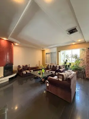 a large living room with couches and a table at Welcome to your Stylish apartment in Oulad Akkou