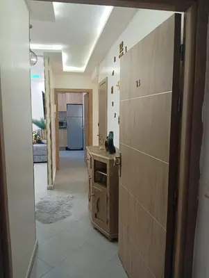 a room with a kitchen with a counter and a hallway at مفتاح الساحل in Oulad Akkou